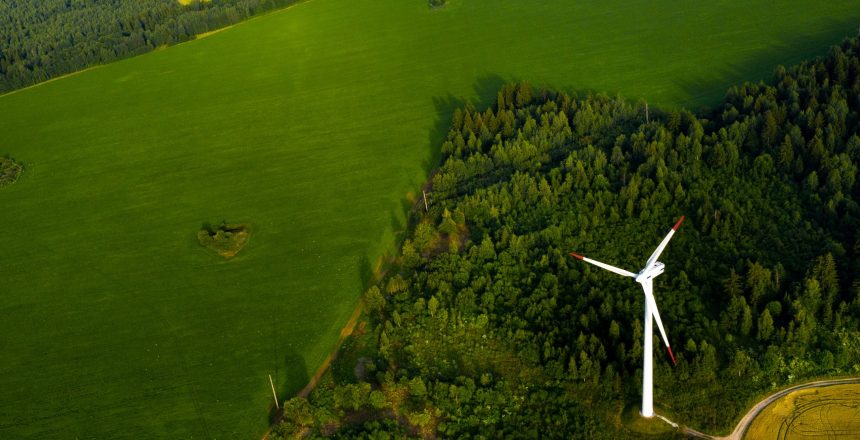 Windmills on the background of forests and fields. Windmill in nature.Belarus.